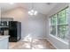 Bright breakfast area with a window and view of the backyard at 7074 Springgrove Ct, Austell, GA 30168