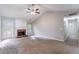 Large living room with fireplace, back door, and neutral paint at 7074 Springgrove Ct, Austell, GA 30168
