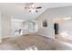 Open-concept living space with natural light and access to the kitchen at 7074 Springgrove Ct, Austell, GA 30168