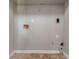 Utility room features hookups and tile floors at 7074 Springgrove Ct, Austell, GA 30168