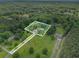 Aerial view of a property with lush greenery and wooded surroundings, showing privacy and ample space at 105 Tranquility Dr, Villa Rica, GA 30180