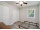 Bedroom featuring wood-look floors, two closets, a ceiling fan and a window for lots of light at 105 Tranquility Dr, Villa Rica, GA 30180