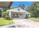 Charming home with a brick facade and a covered carport area at 105 Tranquility Dr, Villa Rica, GA 30180