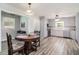 Bright kitchen with stainless steel appliances, neutral cabinets, and wood flooring at 105 Tranquility Dr, Villa Rica, GA 30180