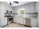 Well-equipped kitchen with stainless steel appliances, and ample counter space at 105 Tranquility Dr, Villa Rica, GA 30180