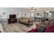 Spacious living room with wood flooring, neutral decor, and plenty of seating at 105 Tranquility Dr, Villa Rica, GA 30180