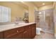Bathroom with a well-lit vanity, a white countertop, and a glass-enclosed shower at 1203 Glenridge Ne Pl, Atlanta, GA 30342