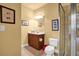 Cozy bathroom featuring a vanity with wood cabinetry and a glass-enclosed shower at 1203 Glenridge Ne Pl, Atlanta, GA 30342