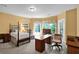 Serene bedroom with abundant natural light, a four-poster bed and a dedicated workspace at 1203 Glenridge Ne Pl, Atlanta, GA 30342