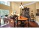 Dining area adjacent to the living room, featuring hardwood floors and stylish lighting at 1203 Glenridge Ne Pl, Atlanta, GA 30342