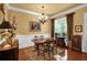 Traditional dining room offers hardwood floors, elegant chandelier, and ample space for entertaining at 1203 Glenridge Ne Pl, Atlanta, GA 30342