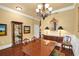 Spacious dining room features hardwood floors, a chandelier, and elegant furnishings at 1203 Glenridge Ne Pl, Atlanta, GA 30342