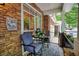 Cozy front porch featuring a seating area, plants, and an inviting outdoor aesthetic at 1203 Glenridge Ne Pl, Atlanta, GA 30342