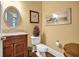 Charming half bathroom with a granite sink, hardwood floors, and tasteful decor at 1203 Glenridge Ne Pl, Atlanta, GA 30342