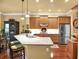Well-lit kitchen with granite countertops, stainless steel appliances, and breakfast bar at 1203 Glenridge Ne Pl, Atlanta, GA 30342