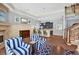 Stylish living room featuring elegant seating, a fireplace, and a cozy kitchenette at 1203 Glenridge Ne Pl, Atlanta, GA 30342