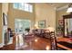 Bright living room featuring tall ceilings, hardwood floors, fireplace and French doors to deck at 1203 Glenridge Ne Pl, Atlanta, GA 30342