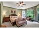 Bright main bedroom with a sitting area, large windows, and ceiling fan at 1203 Glenridge Ne Pl, Atlanta, GA 30342