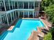 Inviting community pool surrounded by lounge chairs and well-maintained patio area, great for relaxation at 1203 Glenridge Ne Pl, Atlanta, GA 30342
