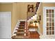 Staircase with carpet runner and wood railing leads to the upper level at 1203 Glenridge Ne Pl, Atlanta, GA 30342
