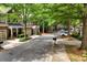 Charming townhomes line a tree-filled street, creating a serene and inviting neighborhood setting at 1203 Glenridge Ne Pl, Atlanta, GA 30342