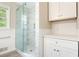 Modern bathroom featuring glass shower door, sleek white cabinets, and clean, contemporary design at 175 Smith Ferguson Rd, Dallas, GA 30157