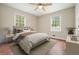 Cozy bedroom featuring hardwood floors, a ceiling fan, and bright natural light at 175 Smith Ferguson Rd, Dallas, GA 30157