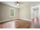 Bedroom featuring hardwood floors, natural light, and a view of the sliding barn door at 175 Smith Ferguson Rd, Dallas, GA 30157