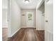 Hallway with vinyl wood floors, a closet, and a door that leads to the outside at 175 Smith Ferguson Rd, Dallas, GA 30157