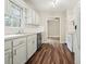Clean kitchen features white appliances, bright cabinets, and an open layout to nearby rooms at 175 Smith Ferguson Rd, Dallas, GA 30157