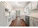 Bright kitchen boasting white cabinets, appliances, and subway tile, designed for modern functionality at 175 Smith Ferguson Rd, Dallas, GA 30157