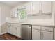 Modern kitchen featuring white cabinets, subway tile backsplash, and stainless steel appliances at 175 Smith Ferguson Rd, Dallas, GA 30157