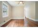 Cozy living room featuring wood floors, a ceiling fan, and a window for natural light at 175 Smith Ferguson Rd, Dallas, GA 30157