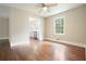 Charming living room with hardwood floors, natural light, and a glimpse of the adjacent kitchen at 175 Smith Ferguson Rd, Dallas, GA 30157