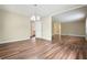 Open living room featuring hardwood floors and a view into another room and the kitchen at 175 Smith Ferguson Rd, Dallas, GA 30157