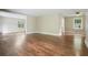Spacious living room featuring pristine hardwood flooring, neutral walls, and seamless flow at 175 Smith Ferguson Rd, Dallas, GA 30157