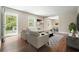 Bright living room showcases hardwood floors, neutral decor, and seamless flow to the dining area at 175 Smith Ferguson Rd, Dallas, GA 30157