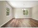 Charming living room with hardwood floors, board and batten wall paneling, and lots of natural light at 175 Smith Ferguson Rd, Dallas, GA 30157