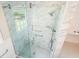 Close-up of glass enclosed shower featuring marble tile, dual shower heads, and modern hardware at 175 Smith Ferguson Rd, Dallas, GA 30157