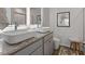 Modern bathroom with double square vessel sinks and framed, backlit mirrors at 229 Ivey Ter, Temple, GA 30179