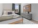 Bedroom featuring a patterned rug, neutral paint, and modern furniture at 229 Ivey Ter, Temple, GA 30179