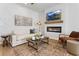Cozy living room with modern fireplace, stylish furniture and decorative wall accents at 229 Ivey Ter, Temple, GA 30179
