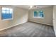 Spacious bedroom with plush carpet, two bright windows, and ample natural light at 3508 Sweetgum Ln, Decatur, GA 30032