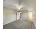 Large bedroom featuring a ceiling fan, plush carpeting, and an ensuite bathroom at 3508 Sweetgum Ln, Decatur, GA 30032