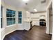 Bright kitchen features white cabinets, stainless appliances, and views from multiple windows at 3508 Sweetgum Ln, Decatur, GA 30032