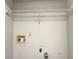 Empty laundry room featuring white walls, utility hookups, and a storage rack above at 3508 Sweetgum Ln, Decatur, GA 30032