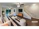 Bright living room features modern decor, dark wood floors, and a staircase to the second floor at 3508 Sweetgum Ln, Decatur, GA 30032