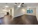 Large living space with dark wood floors, white trim and modern finishes with an open concept layout at 3508 Sweetgum Ln, Decatur, GA 30032