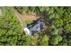 Aerial view of a stunning home nestled amidst lush greenery, highlighting its private and serene setting at 5567 Tyree Rd, Winston, GA 30187