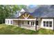 Expansive outdoor living space with a large patio and a covered porch at 5567 Tyree Rd, Winston, GA 30187